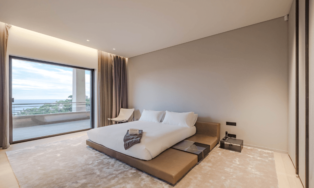 Cozy bedroom suite with terrace access and countryside view